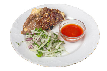 Grilled Meat with Onion Salad and Red Sauce on a White Plate isolated