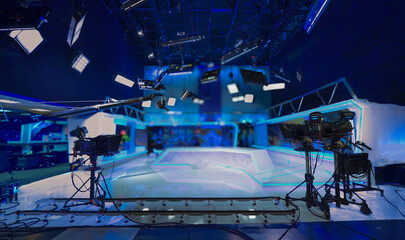 Abstract blurred background with television and lighting equipment in a television studio