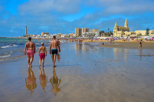 Chipiona, Spain, Aug 9 2019, Walking along Regla beach in Chipiona, Cadiz on a sunny August day