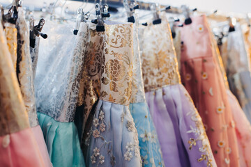 Hanbok selection in store boutique, traditional Korean national clothing, Hanbok rental shop  in the streets of Seoul center, South Korea, variety selection of different multicoloured Hanbok costume