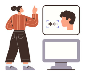 Woman pointing at a digital interface with speech recognition while standing near a computer monitor. Ideal for technology, AI, remote work, innovation, voice tech, communication, user interaction