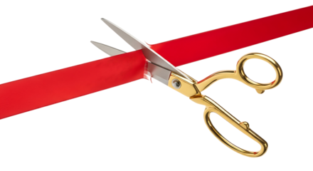 Golden scissors cutting a red ribbon isolated on transparent background
