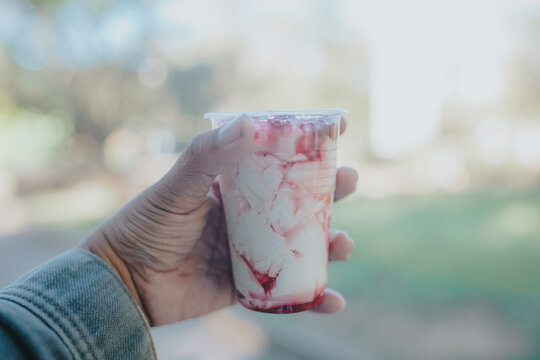 Hand Holding a Cup of Strawberry Taho in Baguio City, Philippines