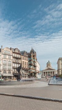 Timelapse hyperlapse of the Musical Instrument Museum (MIM) in the former Old England department store on Coudenberg street, Brussels, Belgium. Place Royale square in the background under blue skies