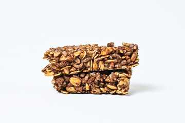 Granola Bars isolated on white background. Two. pile, stack. High protein snack. Broken, half. Close up view. clipping path. Side.