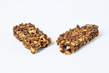 Granola Bar isolated on white background. pile, stack. High protein snack. close up view. clipping path. Broken, half.