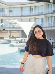 Body positive curvy Asian woman smiling and enjoying casual day.