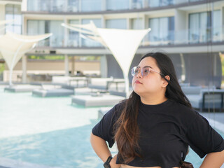 Body positive curvy Asian woman smiling and enjoying casual day.