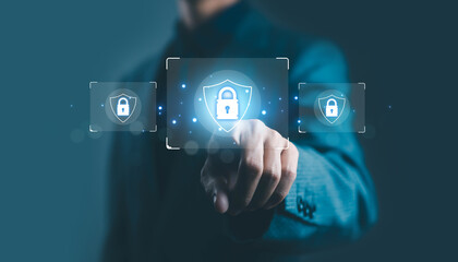 Businessman touching virtual security lock icon on digital screen representing cybersecurity, data protection, privacy, and secure network technology in modern business concept.