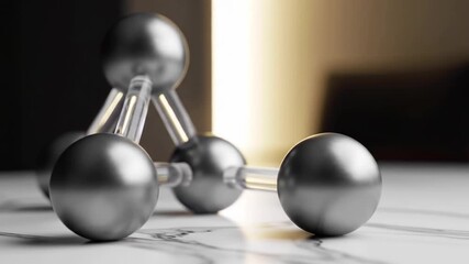 Silver Spheres Connected by Transparent Rods on Marble Surface - Powered by Adobe