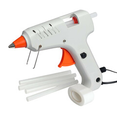 White glue gun with orange trigger and glue sticks lies on black background.