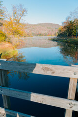 Beautiful Autumn Forest with Mountain Fog and A Lake