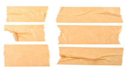 Several ripped pieces of brown adhesive tape on a black background