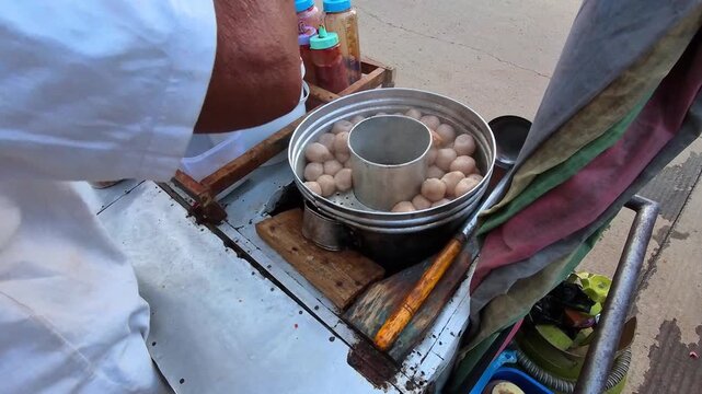 Footage of preparing tapioca balls and tofu meatball soup in a steamer. Videography of a street food vendor preparing a tapioca dish. Footage of a variety of tapioca-based dishes in High Quality 4k.