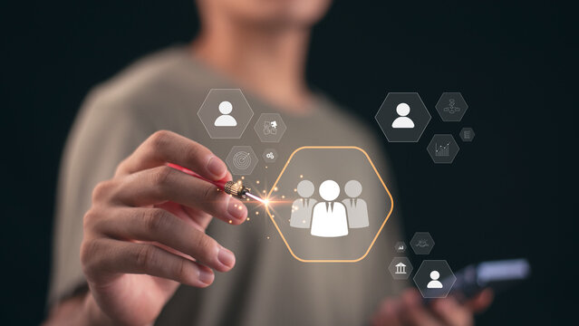 A person interacting with a digital HR interface showing employee icons, symbolizing recruitment, human resources management, candidate evaluation, and talent analytics in modern business technology.