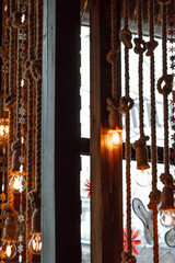 beautifully arranged display featuring golden ornaments and decorative plants creates vibrant atmosphere, enhancing festive spirit in cozy indoor space. vertical. close up.