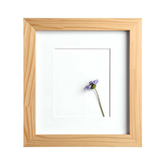 A single dried purple flower is matted within a light wood picture frame.
