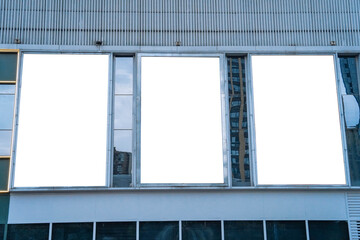 triple blank billboards and high rise business building