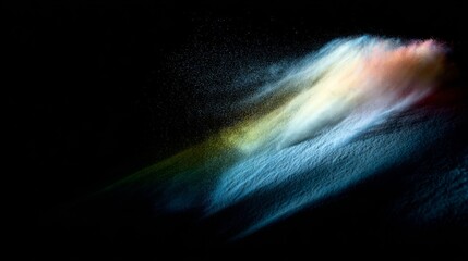 Colorful particles in motion create an abstract visual effect with vibrant hues blending dynamically against a dark back