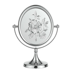 Ornate metal tabletop mirror displays floral relief on a pedestal.