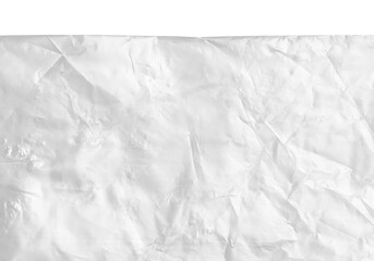 plastic transparent cellophane bag on white background. The texture looks blank and shiny. The plastic surface is wrinkly and tattered making abstract pattern