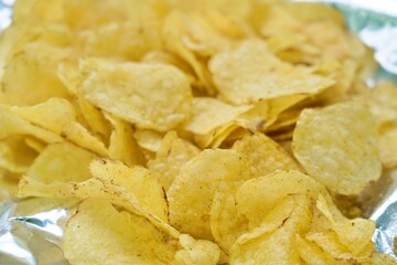 crispy potato chips captured with shallow depth of field, highlighting texture and golden color