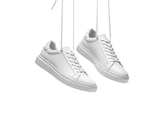 Pair of white leather sneakers hanging by strings isolated on transparent background