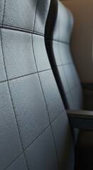 Fototapeta premium Quilted synthetic upholstery on a modern seat surface creates a textured detail.