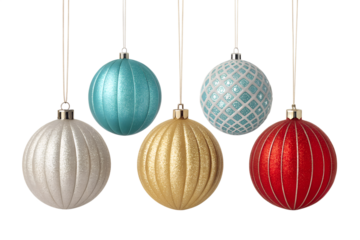 Five decorative christmas ornaments in various colors hanging by white strings isolated on transparent background