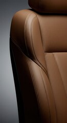 Fototapeta premium Luxurious brown leather seat with detailed stitching and smooth texture.