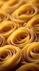 Close-up view of intricately arranged pasta shaped like roses, showcasing texture and color, ideal for culinary art
