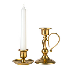 Brass candleholders with a white candle on black background.