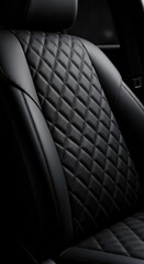 Obraz premium Luxurious black quilted leather seat interior with fine stitching.