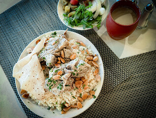 Traditional Jordanian Mansaf with Lamb, Rice, and Jameed Yogurt Sauce 