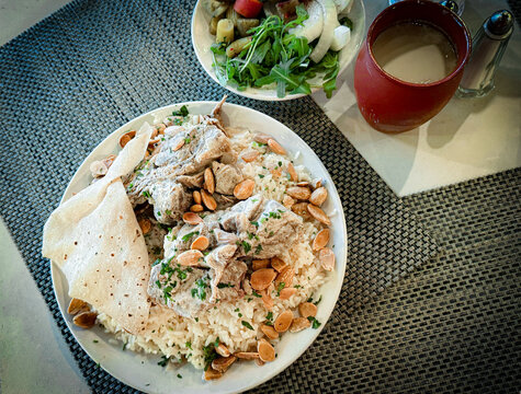 Traditional Jordanian Mansaf with Lamb, Rice, and Jameed Yogurt Sauce 