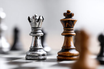 Fototapeta premium Chess pieces in battle, concept of strategy and competition