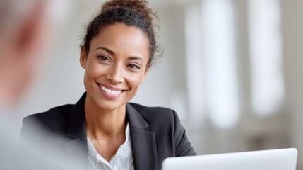 A professional conducting an interview via video call, showing clear communication and engagement.