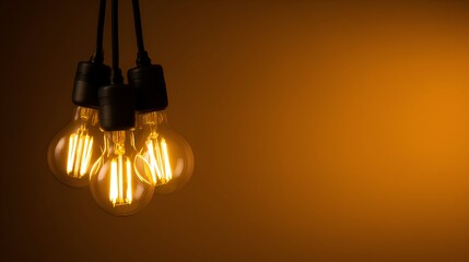 Warm glowing light bulbs hanging against a soft orange background, creating a cozy atmosphere