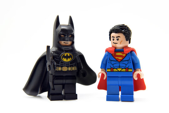 Lego minifigure of Superman in costume and batman in black coat. Editorial illustrative image of popular children toys.