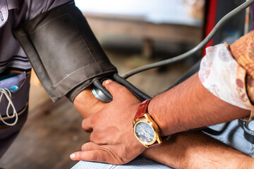 Get Your Heart Pumping with Regular Checkups A doctor checks blood pressure, ensuring health and wellness with care and a stylish watch, a sign of modern healthcare