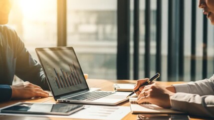 Business professionals collaborating on financial data analysis, planning, and investment strategies in a meeting - Powered by Adobe