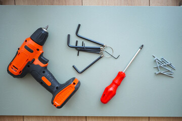 Power tools and hardware displayed on a workbench