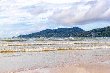 Patong Beach Phuket with turquoise blue water white sand Thailand.