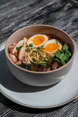 Ramen soup in cafe on wooden table. 