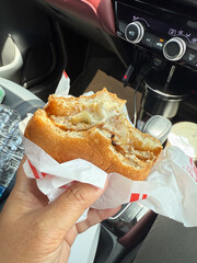 A Samurai Burger with bite marks on it.