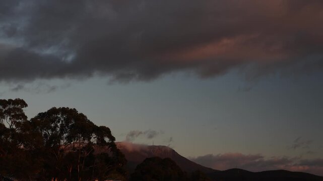 sunrise over Tasmanian mountains with eucalyptus trees timelapse