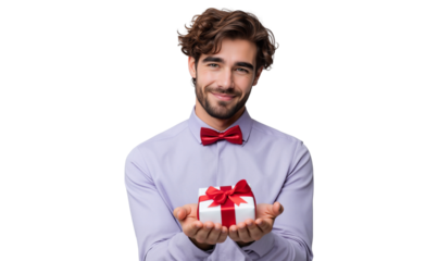 Handsome cheerful young man holding a gift box, offering present to camera, isolated on transparent background