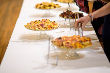 Delicious Party Appetizers and Finger Foods Arranged Professionally on Elegant Serving Stands for a Celebration Event Reception or Catering Service Display