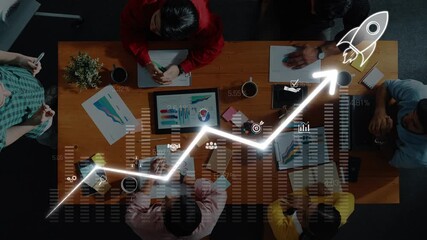 Aerial view of a diverse business team engaging in a meeting focused on growth strategies, analyzing trends, and discussing ideas in a modern office environment. Raster - Powered by Adobe