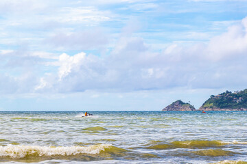 Patong Beach Phuket with turquoise blue water white sand Thailand.
